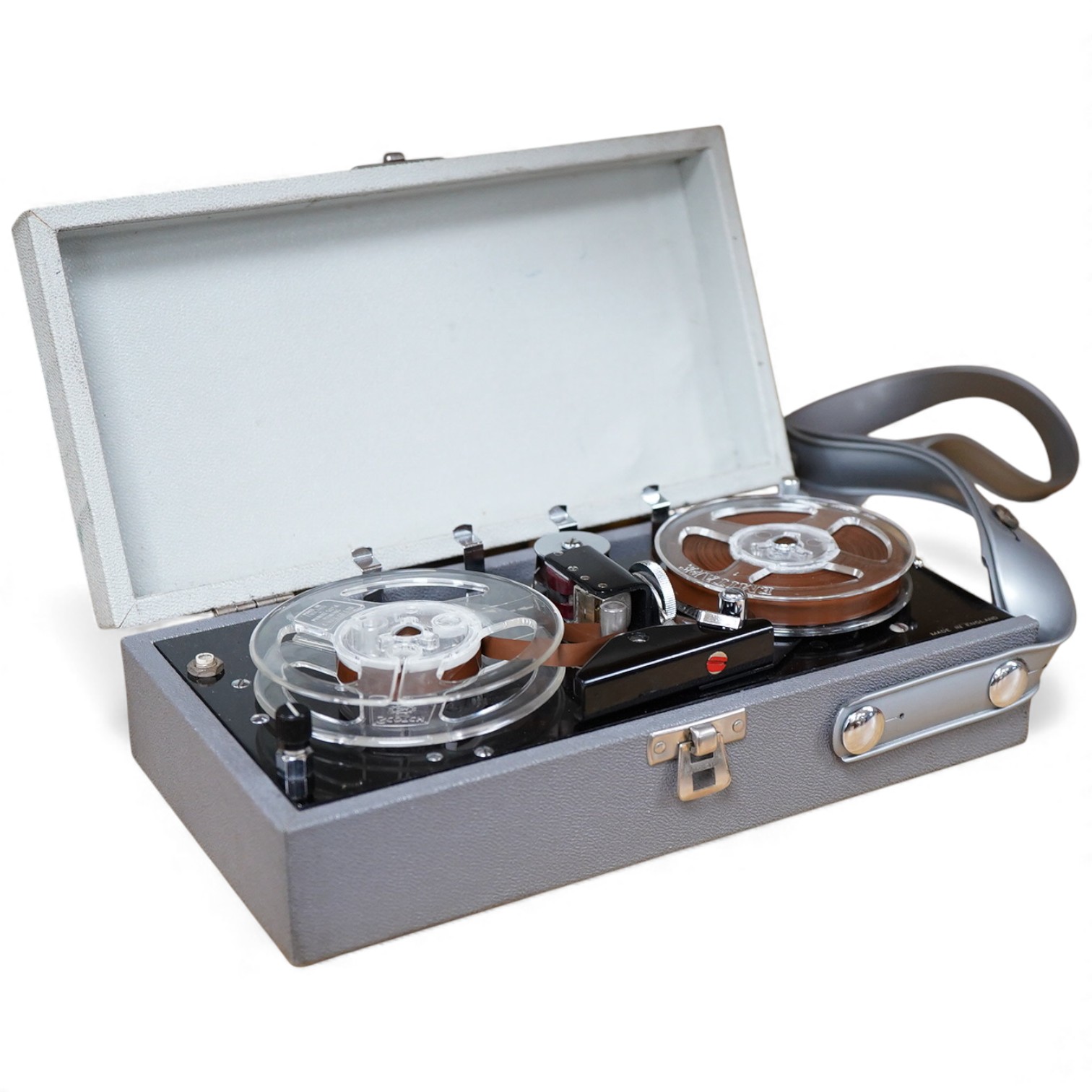A late 1950s portable 9v battery powered reel-to-reel FI-Cord 1A, ‘Fidelity Recording’, as used by BBC reporters, with original vinyl strap and earphone